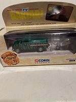 Front view of boxed die-cast Land Rover with trailer and figures from Dakar TV programme