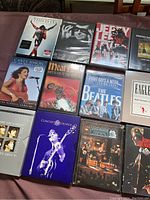 Photo showing 13 music DVDs featuring The Beatles and various artists such as Michael Jackson, Carly Simon, Jerry Lee Lewis, and more.