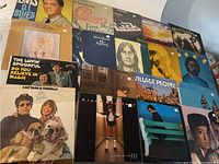 Overview of 16 vinyl LP rock music records with visible artists and album artwork