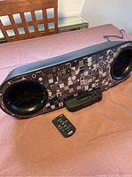 Full view of the Sony boom box with remote and power cable visible on a table.