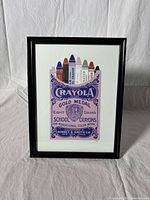 Full view of framed vintage style crayon illustration artwork showing Crayola Gold Medal box and crayons.