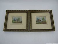 Two small framed fine needlepoint pictures side by side on white surface, showing entire lot with frames and matting visible