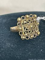 Front view of ring showing square filigree top with granulation and marcasite accents