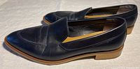 Side profile of the navy leather Everlane women's loafers showing shape, leather texture and sole details.