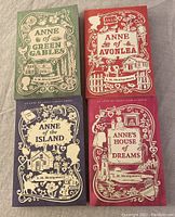 Four paperback books from the Anne of Green Gables series, arranged side by side showing their covers.