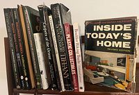 Photo of ten hardcover and paperback collectible and Halloween-themed books standing vertically, covers visible along side edges.