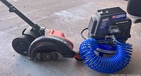 Both electric edger and air compressor shown together.