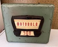 Front view of Motorola 508 car radio showing the cracked Bakelite panel with Motorola 508 logo.