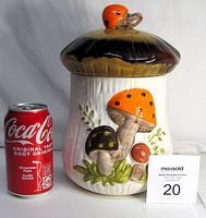 Front and side views of the Mid Century Modern Merry Mushroom ceramic cookie jar with a soda can for scale.