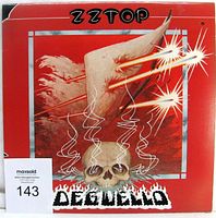 Front cover of ZZ Top Deguello vinyl LP album sleeve with skull and horn artwork.