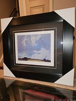 Full frame showing the professionally framed print with protective corners in place.