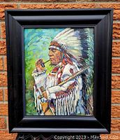 Frontal view of the framed acrylic painting 'The Chief' by Dim Hill showing a Native American chief in profile with colorful background.