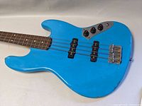 Full-body angled shot showing overall finish, chips and hardware layout