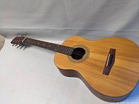 Full view of Fender MA-1 acoustic guitar showing natural finish body and neck