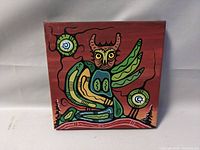 Front view of the indigenous owl painting on square canvas.