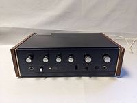 Front view of amplifier showing all control knobs and power indicator