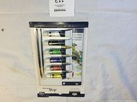 Image showing the front side of the unopened Royal Langnickel Essentials acrylic paint pack including 6 paint tubes and 2 paint brushes.