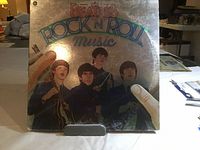 Front cover of The Beatles 'Rock 'n' Roll Music' double album vinyl LP, showing illustrated band members with colorful title text.