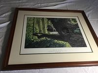 Full view of framed wood duck print showing the image and frame on a cloth background.