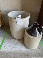 Photo showing both the 3L crock with crown stamp and the glazed jug side by side on a floor.
