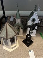 Set of three bird houses and metal horse figurine, showing full items