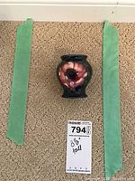 Front view showing the vase height relative to measuring tape and floral decoration.