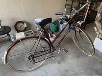 Side view of the complete bicycle showing frame, wheels, rear rack and pedals