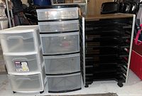 Three plastic storage units shown side by side including a white 3-drawer, a white 5-drawer, and a black 7-shelf organizer on wheels.