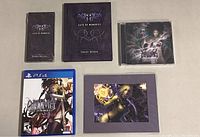 Photo showing the contents of the collection including the PS4 game, Major Arcana card deck, concept artbook, soundtrack CD, framed character artwork.