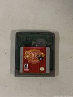 Front view of The Legend of Zelda Oracle of Seasons Game Boy Color cartridge showing label and transparent case.