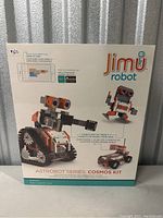 Front view of the Jimu Robot Astrobot Series Cosmos Kit sealed box showing images of the robot models and branding.