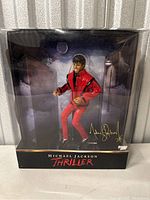 Front view of Michael Jackson Thriller figure inside the original box with display background.