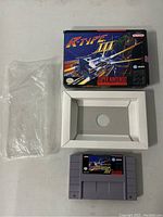 Overhead view showing cartridge, box, inner tray and plastic sleeve