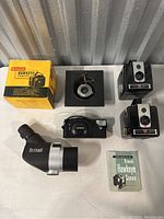 Overview of all lot items on table against corrugated metal background.