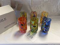 Six tumblers on table next to “Fragile Made in Italy” box