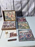Block puzzle arranged flat showing several illustrated scenes of children in outdoor settings, plus box lid and paper clippings.