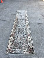 Full length top-down view of the long runner rug showing overall pattern and shape
