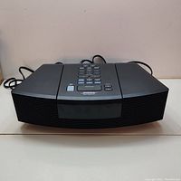 Front left-angled view showing unit, speaker grille and top controls