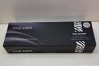 Box front showing the brand José Eber and flat iron size 1.25 inch wide ceramic flat iron.