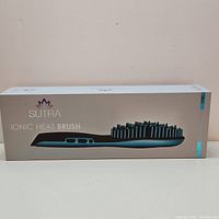 Box and packaging of Sutra Ionic Heat Brush showing brand and product name.