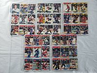 Front side of hockey cards showing player images, uniforms, and team logos