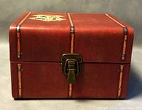 Closed brown collectible box with Hogwarts crest and latch closure