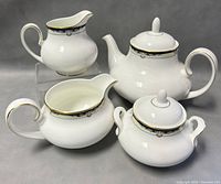 Four-piece Royal Doulton Rhodes bone china set including teapot, sugar bowl, creamer and gravy boat.