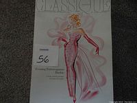 Box cover showing an illustration of Barbie wearing the Evening Extravaganza pink sequin gown with sheer pink large ruffled bow and gloves