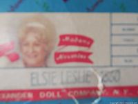 Close-up of Madame Alexander logo and Elsie Leslie name on box showing vintage branding and some shelf wear.