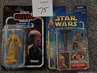 Photo shows two Star Wars action figures in original sealed packaging. Left figure is Supreme Leader Snoke from Last Jedi, right figure is Luke Skywalker from Empire Strikes Back with accessories.