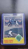 1963 Topps Roger Maris baseball card in plastic holder showing the World Series Game 3 card front.