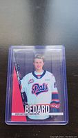 Front side photo of the 2020 Hot Shot Prospects hockey card featuring Conor Bedard in his white Regina Pats jersey, enclosed in a plastic protective case.