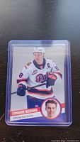 Single image of Connor Bedard 2023 Hot Shot Centres hockey card in protective case.