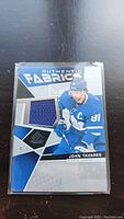 Front view of the John Tavares Authentic Fabrics jersey card showing the fabric swatch and player image.